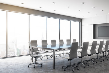Modern concrete meeting room with poster