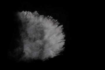 White powder explosion on white background. Colored cloud. Colorful dust explode. Paint Holi.