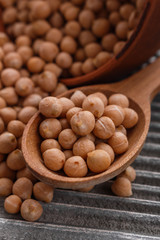 uncooked chickpeas on a wooden rustic background