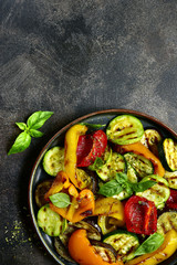 Grilled vegetables (  colorful bell pepper, zucchini, eggplant ) with basil and dry herbs.Top view.