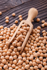 uncooked chickpeas on a wooden rustic background