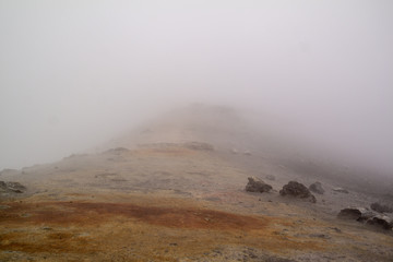 Etna vulcano surrealistic landscape mountain clouds fog lava stone 