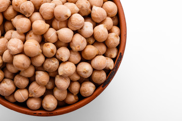 uncooked chickpeas on a white acrylic background