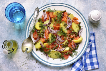 New potato salad with salted salmon, capers and red onion.Top view.