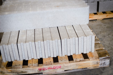 Pallet of concrete blocks industrial design building materials textured background. Build work storage unit.