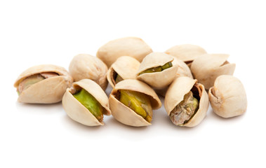 heap of ripe roasted pistachio isolated on white background