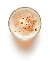 top view of glass of lager beer isolated on white background