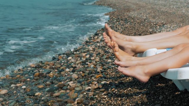 Summer Holiday. The Sea. Feet Splashing in the Surf