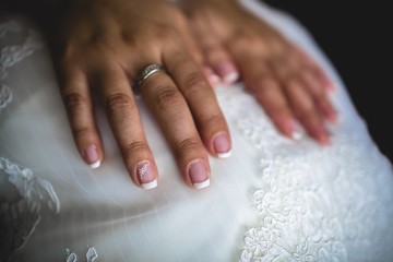 Wedding rings in the hands of a woman in love.