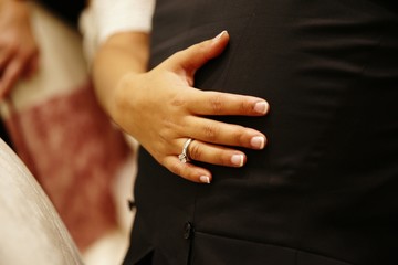 Wedding rings in the hands of a woman in love.