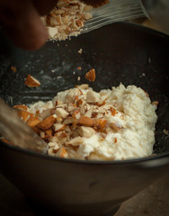 Sprinkling Almonds on Burrata