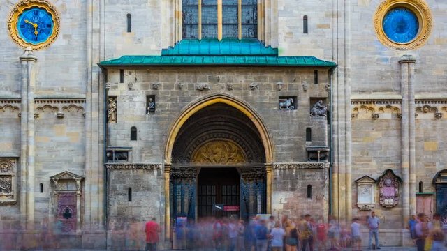 St. Stephen's Cathedral (Stephansdom) entrance with blurred crowd of people in Vienna, Austria. Time lapse. Zoom out effect
