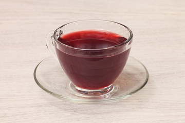 Hibiscus flower tea in glass tea cup      