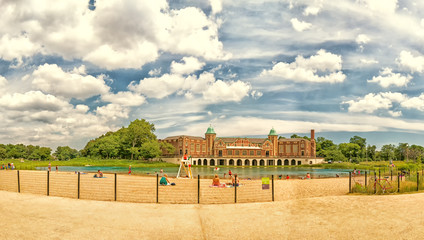 Fototapeta na wymiar Humboldt Park Beach and Fieldhouse. People and families outdoors. Chicago, USA.
