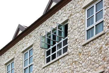 windows and gable roof on stone house