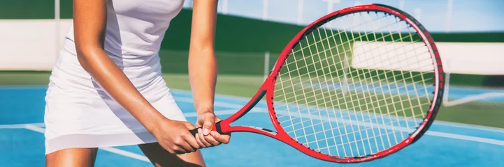Tuinposter Tennis player woman in position holding red racket on outdoor blue tennis court banner panorama header for tennis classes at sports club. © Maridav
