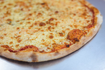 Pizza time on light wooden table background