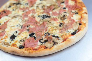 Pizza time on light wooden table background