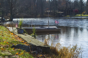 Boat Docked In Lake Half Frozen In Mid-Winter