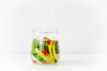 Fototapeta na wymiar Summer drink coctail in glass jar, berries and mint on wooden table