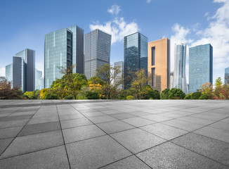 Panoramic skyline and buildings with empty square floor.