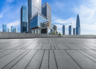 Panoramic skyline and buildings with empty square floor.