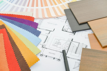Samples of material and drawing on working table of designer
