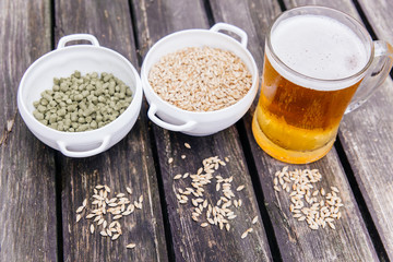 Glass of a tasty home made beer on table