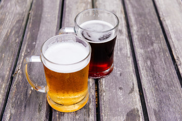 Glass of a tasty home made beer on table