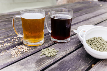 Glass of a tasty home made beer on table