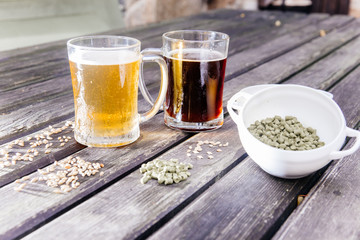 Glass of a tasty home made beer on table