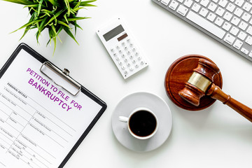 Start of bankruptcy procedure. Petition to file for bankruptcy. Form on white office desk with...
