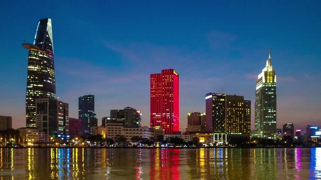 Timelapse or time lapse is fast video. Timelapse landscape sunrise to morning of Ho Chi Minh city or Sai Gon, Vietnam. Royalty high-quality free stock footage time lapse of center city in dawn sky