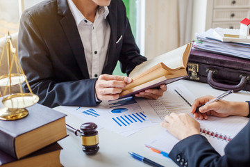 Business lawyer working about legal legislation in courtroom to help their customer
