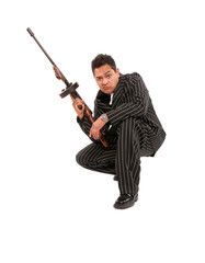 A 1940's styled adult male mafia gangster character wearing a black seersucker suit and holding a machine gun.