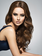 Fototapeta premium Face of a beautiful woman with long brown hair