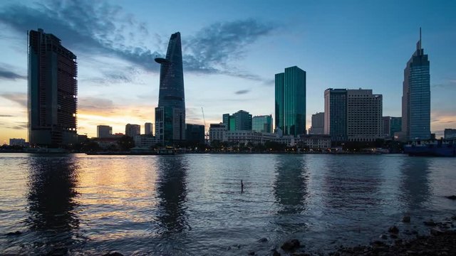 Timelapse or time lapse is fast video. Timelapse landscape sunrise to morning of Ho Chi Minh city or Sai Gon, Vietnam. Royalty high quality free stock footage time lapse of center city in dawn sky
