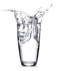 Water splash out of glass isolated on white background.