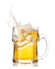 Cold beer splash out of glass isolated on white background.