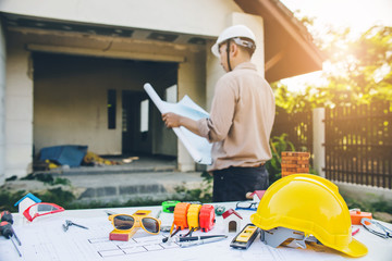 Engineer inspection in workplace for architectural plan