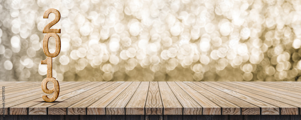 Poster 2019 happy new year wood number (3d rendering) on wood table with sparkling gold bokeh wall,leave space for display or montage of design or content.