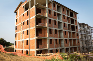 Multistoried, multi-floor building under construction. Industrial background