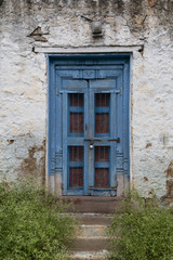 Fototapeta na wymiar old vintage door on retro wall