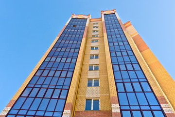 A multi-storey house against the sky.