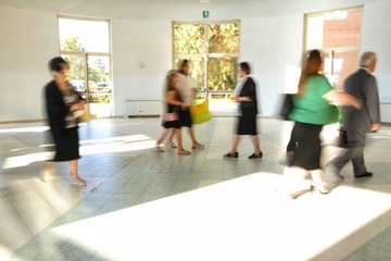 people out of focus in the congress hall corridor