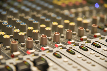 Fototapeta premium Close up of digital sound audio mixer and amplifier equipment or music mixer equalizer console. Sound technician audio mixer equalizer control for background. studio music recording concept
