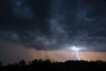 Fotobehang lightning in the sky © Charles