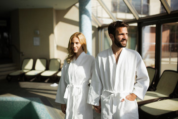 Fototapeta premium Portrait of attractive couple in spa center