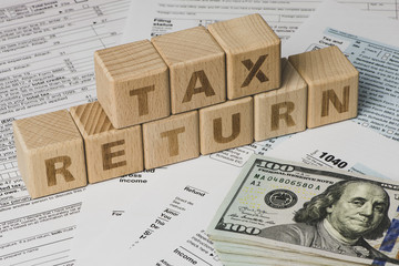 Tax Refund concepts. Tax Refund characters and US currency notes. Tax Return.
