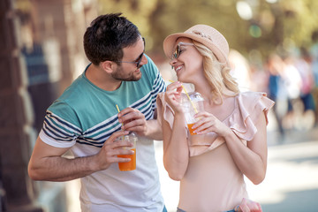 Young couple drinking orange juice